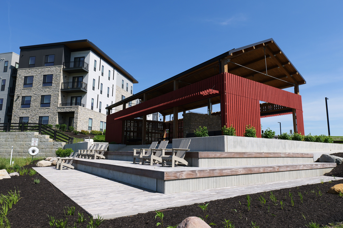 Red pavilion and outdoor seating at the amenity space